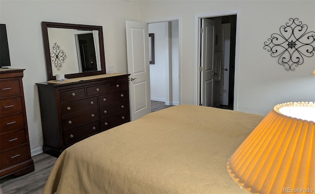 22345 E Bailey Pl, Aurora, CO 80016 - bedroom featuring dark wood-style flooring and baseboards