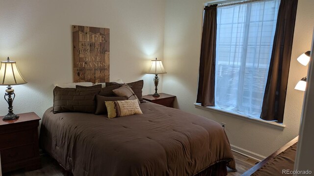 22345 E Bailey Pl, Aurora, CO 80016 - bedroom featuring baseboards and wood finished floors