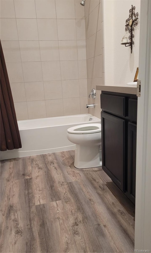 22345 E Bailey Pl, Aurora, CO 80016 - full bathroom with vanity, toilet, wood finished floors, and shower / bath combination