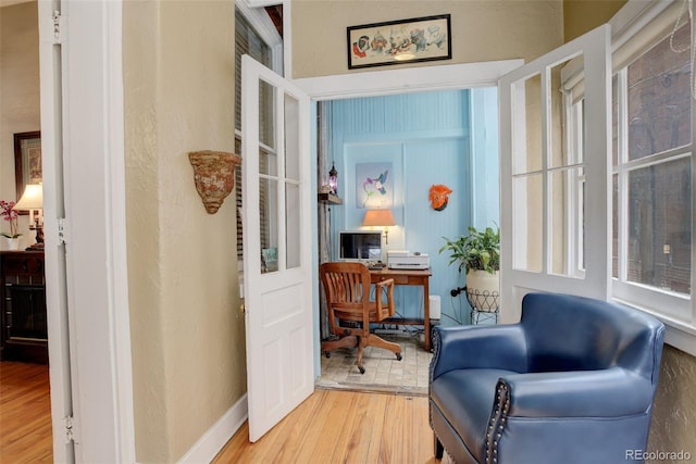 sitting room featuring wood-type flooring