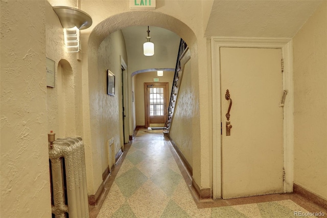 corridor featuring a high ceiling