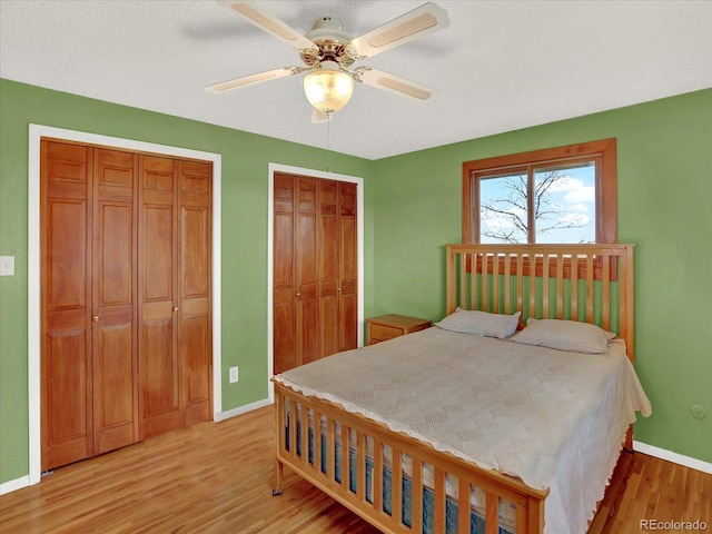 12798 Tomahawk Rd, Parker, CO 80138 - bedroom featuring ceiling fan, baseboards, multiple closets, and light wood-type flooring