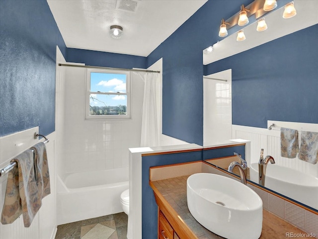 12798 Tomahawk Rd, Parker, CO 80138 - full bathroom featuring shower / bath combination with curtain, toilet, vanity, and visible vents