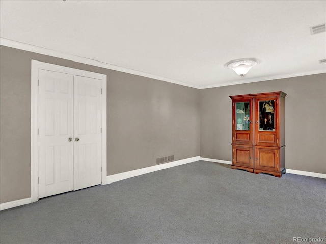 12798 Tomahawk Rd, Parker, CO 80138 - empty room featuring baseboards, crown molding, carpet flooring, and visible vents