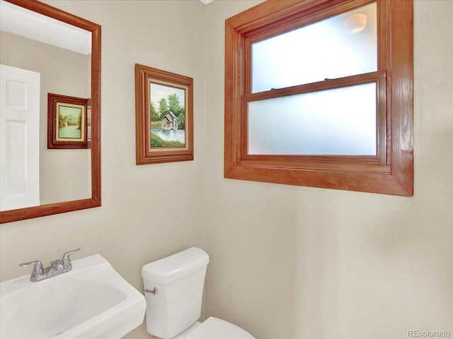 12798 Tomahawk Rd, Parker, CO 80138 - half bathroom featuring toilet and a sink