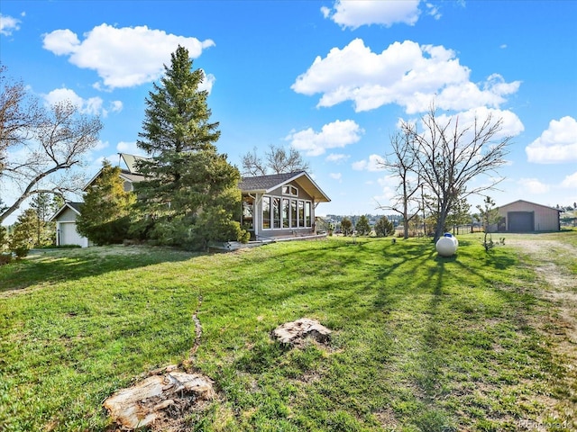12798 Tomahawk Rd, Parker, CO 80138 - view of yard with a garage