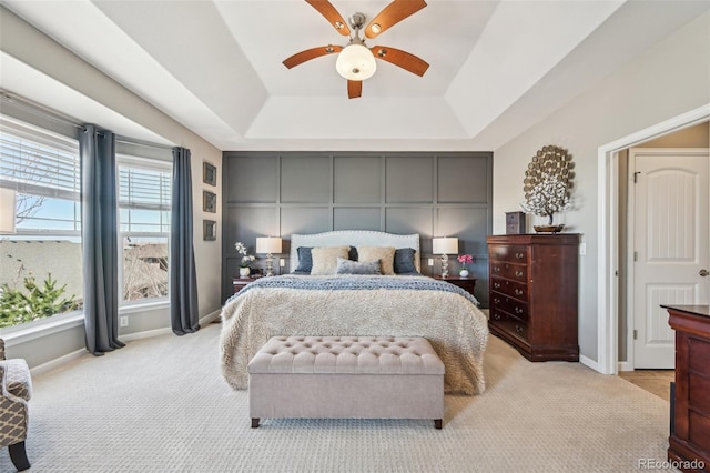 27423 E Euclid Dr, Aurora, CO 80016 - bedroom with a raised ceiling, light colored carpet, baseboards, and a ceiling fan
