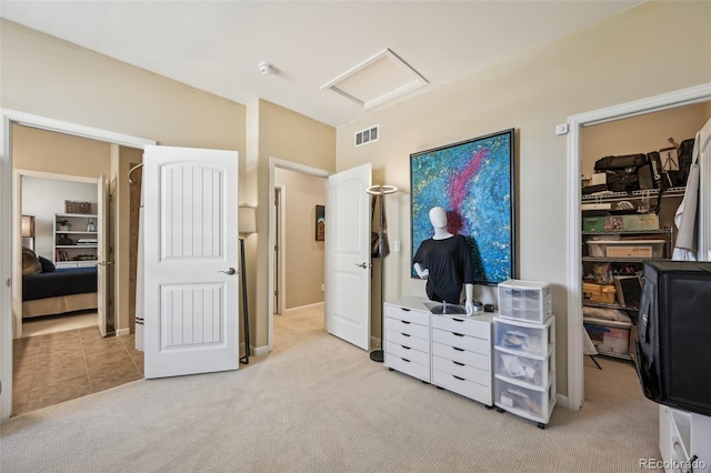 27423 E Euclid Dr, Aurora, CO 80016 - bedroom featuring attic access, light carpet, a spacious closet, and a closet