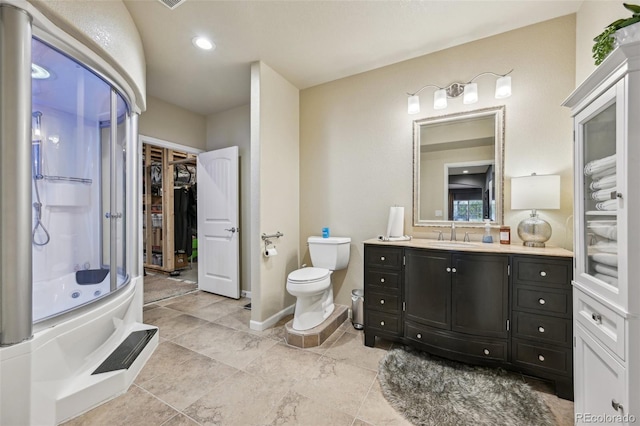 27423 E Euclid Dr, Aurora, CO 80016 - full bathroom with a shower stall, toilet, vanity, a walk in closet, and baseboards