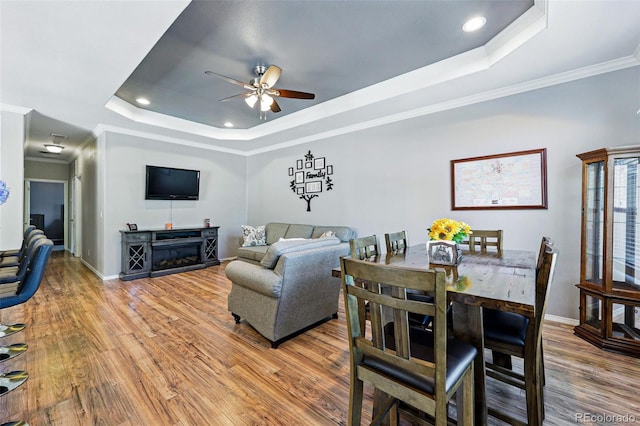 6231 Indian Paintbrush St Unit 214, Frederick, CO 80530 - living area with a raised ceiling, a ceiling fan, light wood-style flooring, ornamental molding, and recessed lighting