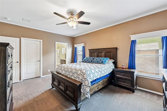 6231 Indian Paintbrush St Unit 214, Frederick, CO 80530 - carpeted bedroom with baseboards, crown molding, a ceiling fan, and ensuite bathroom