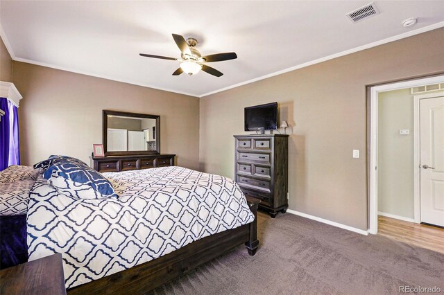 6231 Indian Paintbrush St Unit 214, Frederick, CO 80530 - carpeted bedroom featuring ornamental molding, baseboards, and ceiling fan
