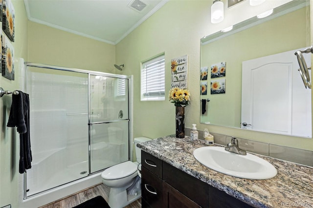 6231 Indian Paintbrush St Unit 214, Frederick, CO 80530 - full bath with crown molding, a shower stall, toilet, vanity, and wood finished floors