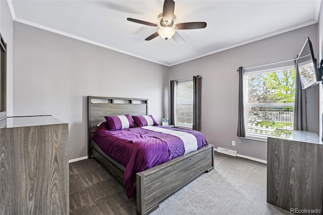 6231 Indian Paintbrush St Unit 214, Frederick, CO 80530 - bedroom with carpet flooring, baseboards, crown molding, and ceiling fan