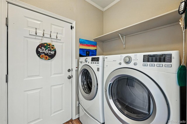 6231 Indian Paintbrush St Unit 214, Frederick, CO 80530 - laundry area with separate washer and dryer and crown molding