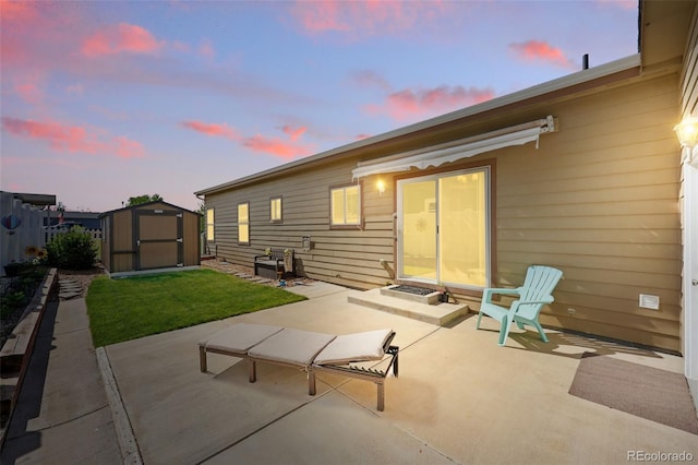 6231 Indian Paintbrush St Unit 214, Frederick, CO 80530 - back of house with a patio area, a storage shed, and an outbuilding