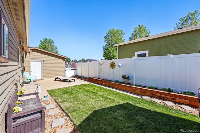 6231 Indian Paintbrush St Unit 214, Frederick, CO 80530 - view of yard featuring a patio area