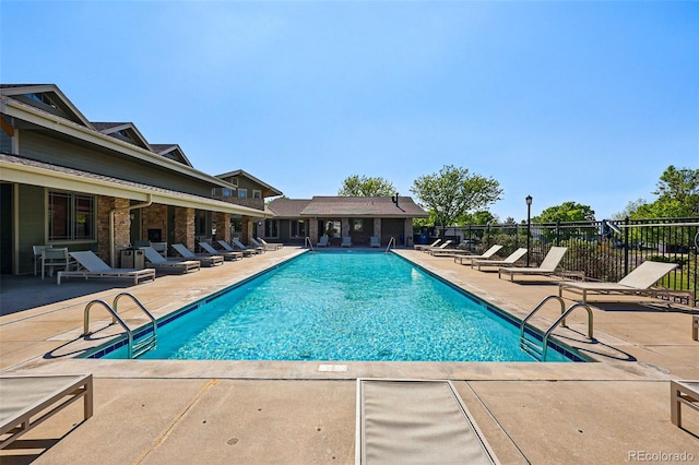 6231 Indian Paintbrush St Unit 214, Frederick, CO 80530 - community pool featuring a patio and fence