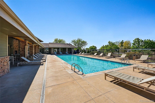 6231 Indian Paintbrush St Unit 214, Frederick, CO 80530 - community pool with fence and a patio