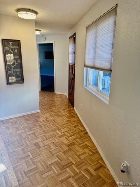 corridor featuring light parquet floors