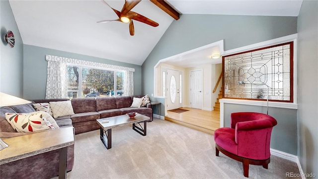 carpeted living room with beam ceiling, high vaulted ceiling, baseboards, and ceiling fan