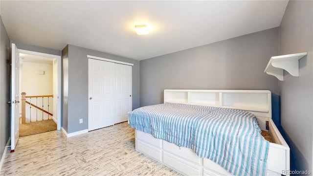 bedroom with a closet and baseboards