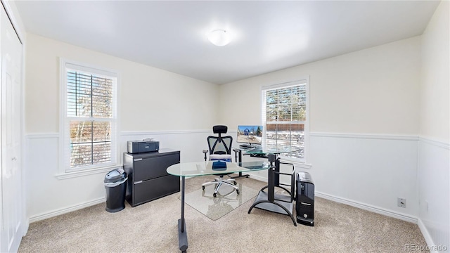 carpeted office featuring a wainscoted wall