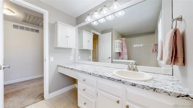 bathroom with visible vents, a shower with shower curtain, tile patterned flooring, baseboards, and vanity