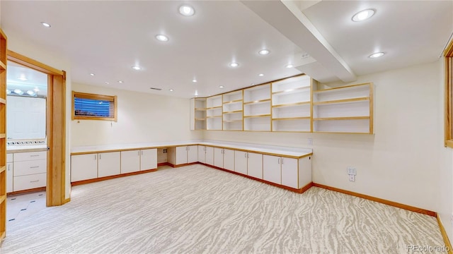 unfurnished office featuring recessed lighting, light colored carpet, and baseboards