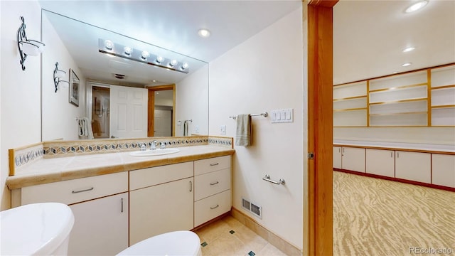 bathroom with vanity, visible vents, recessed lighting, tile patterned floors, and toilet