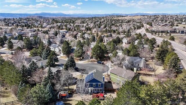 birds eye view of property featuring a mountain view and a residential view