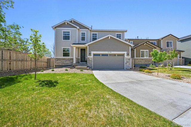5078 S Quail St, Littleton, CO 80127 - craftsman inspired home featuring a garage, concrete driveway, and stone siding