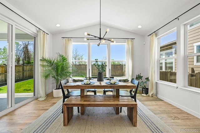 5078 S Quail St, Littleton, CO 80127 - dining area featuring vaulted ceiling, light wood-style floors, and a chandelier