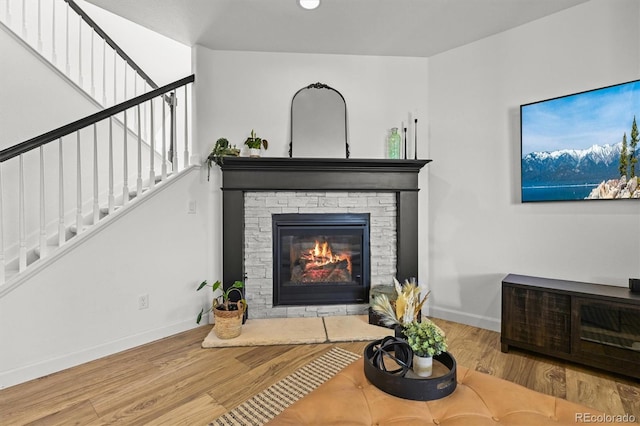 5078 S Quail St, Littleton, CO 80127 - living area with stairs, wood finished floors, and a fireplace