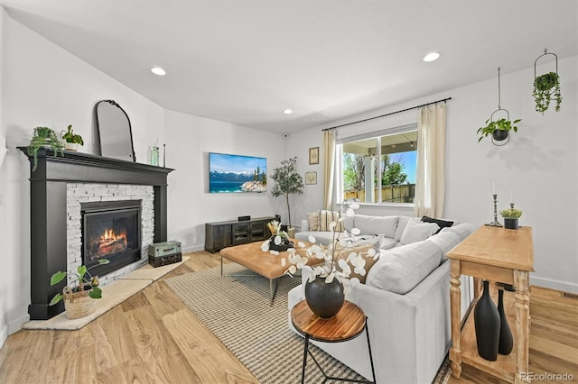 5078 S Quail St, Littleton, CO 80127 - living area featuring a fireplace, wood finished floors, and recessed lighting