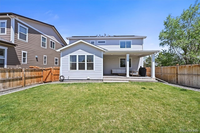 5078 S Quail St, Littleton, CO 80127 - rear view of house with a fenced backyard and a patio