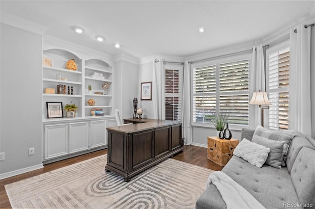 office space with ornamental molding, baseboards, and dark wood-style floors