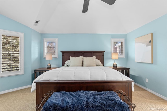bedroom featuring lofted ceiling, light carpet, baseboards, and visible vents