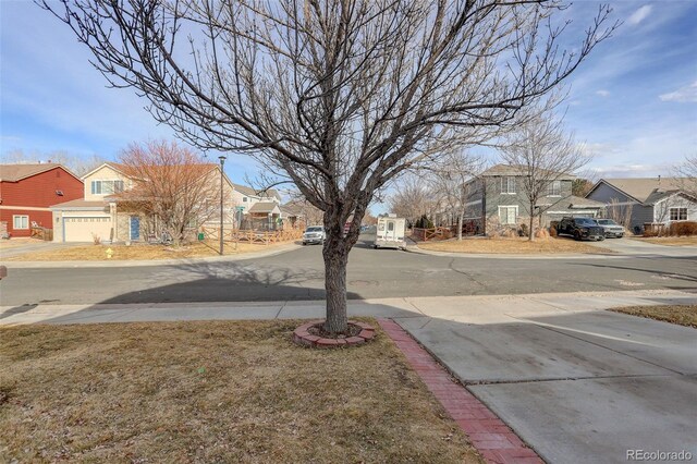 view of road with sidewalks and a residential view