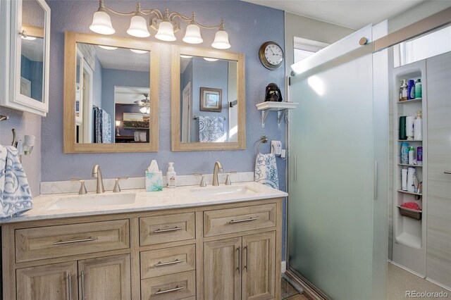 bathroom featuring double vanity, a sink, and a ceiling fan