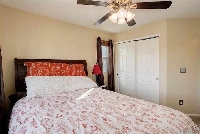 bedroom with a closet, carpet flooring, ceiling fan, and baseboards