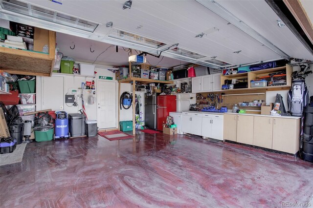 garage with freestanding refrigerator