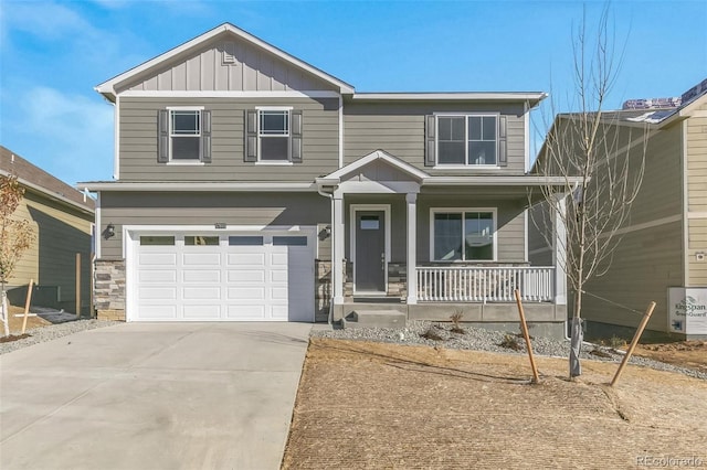 craftsman-style home with a garage and covered porch