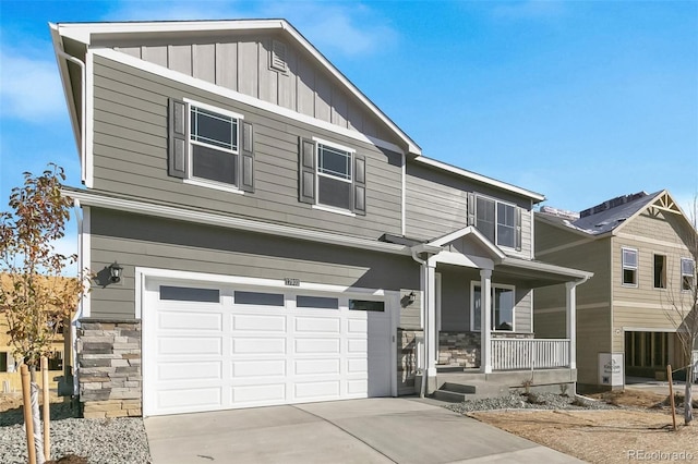 view of front of home featuring a garage and covered porch