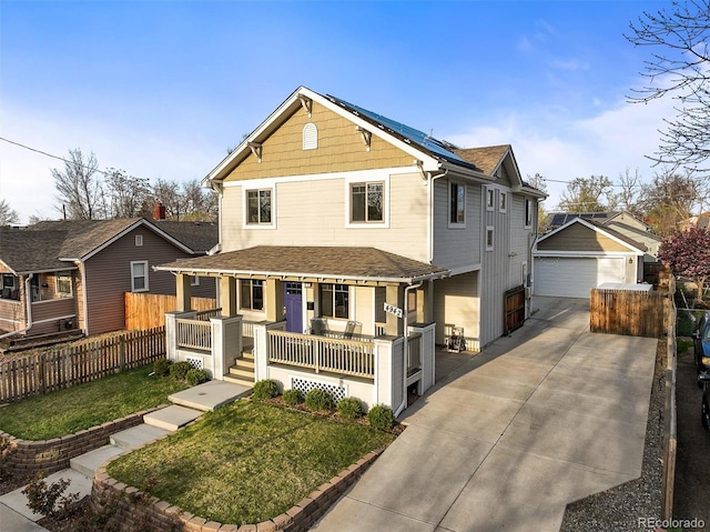 4942 Grove St, Denver, CO 80221 - view of front of home featuring a garage, fence, solar panels, a front yard, and a porch