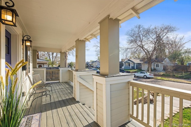 4942 Grove St, Denver, CO 80221 - wooden deck with a porch and a residential view