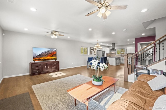 4942 Grove St, Denver, CO 80221 - living room with recessed lighting, ceiling fan with notable chandelier, and stairs