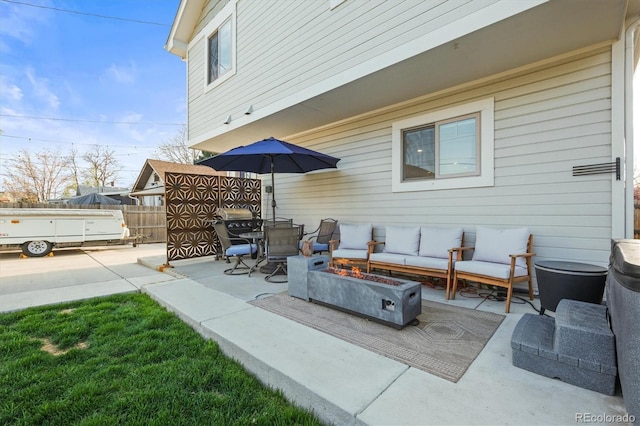4942 Grove St, Denver, CO 80221 - view of patio featuring an outdoor living space with a fire pit and fence