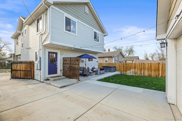 4942 Grove St, Denver, CO 80221 - back of house featuring fence, a patio, an outdoor living space, entry steps, and central AC unit