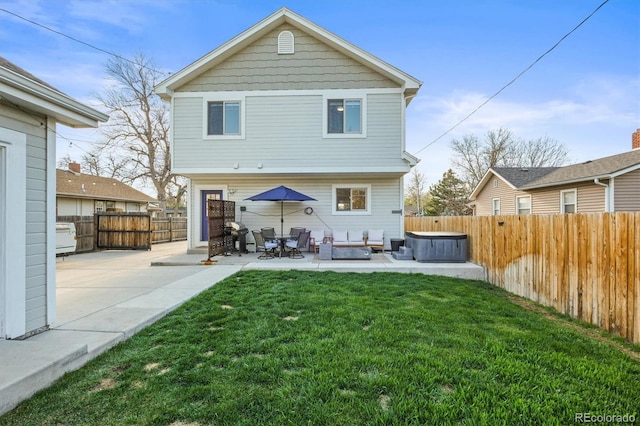 4942 Grove St, Denver, CO 80221 - back of house with a lawn, a patio, outdoor lounge area, and a fenced backyard